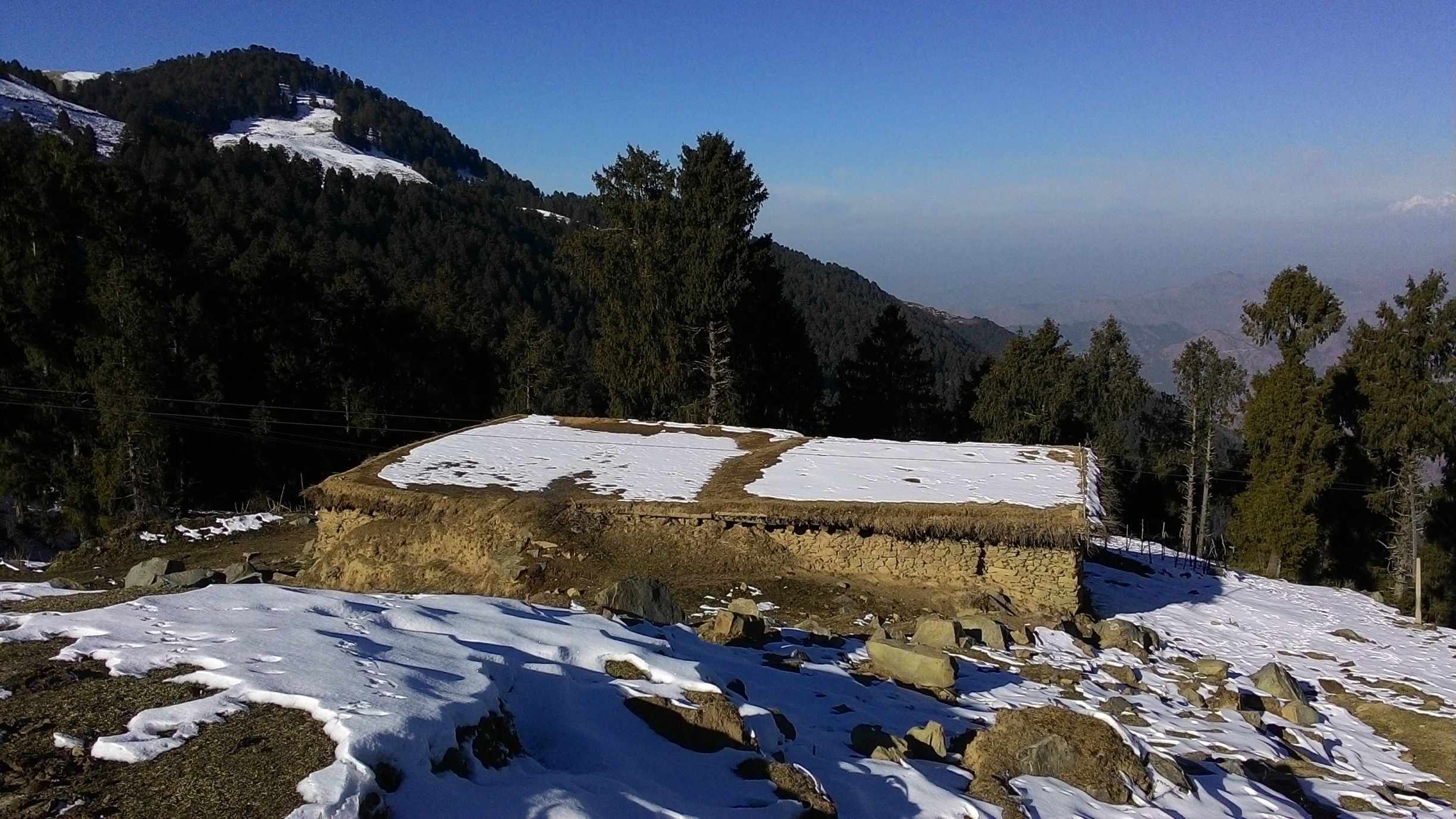 A Gujjar hut on the snow covered trail
