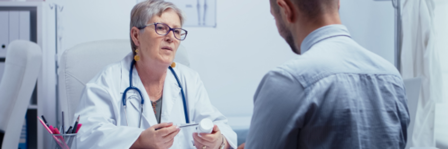 man having consultation with gp