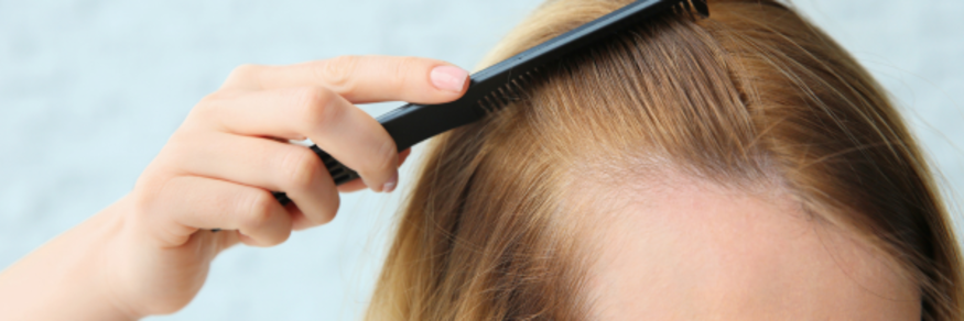 Woman brushes hair