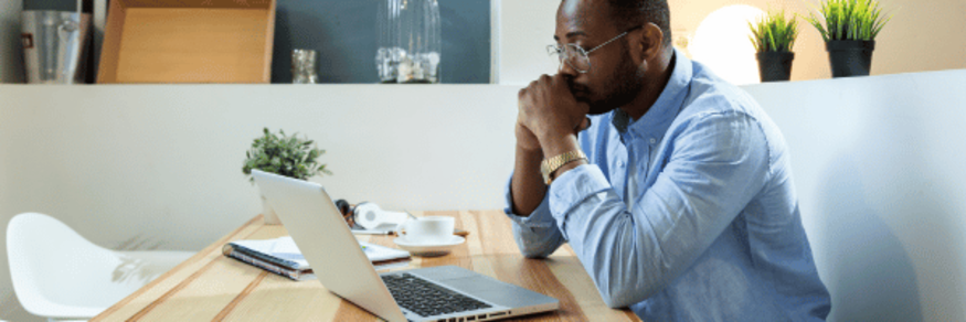man looking at laptop