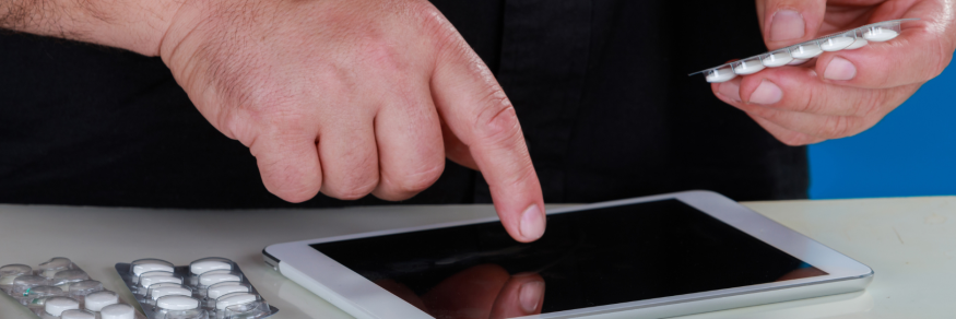 Man ordering tablets on ipad