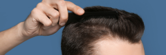 man brushing hair