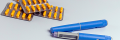 tablets and injections on grey background