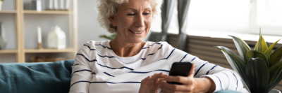 Lady smiling at phone