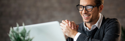 Man happy at computer