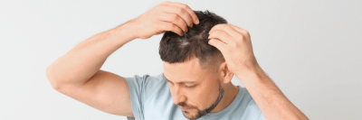 man touching hair