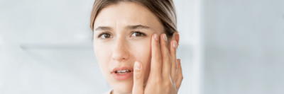 lady touching her eye