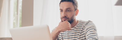 man looking at laptop