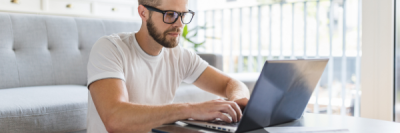 man looking at laptop