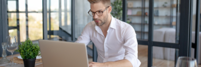 man looking at laptop