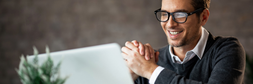 Man happy at computer