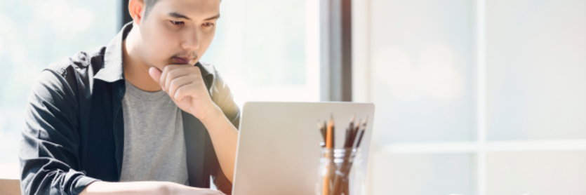 man looking at laptop
