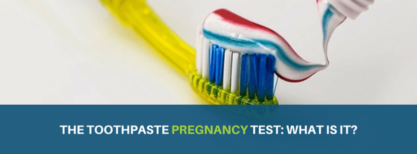 Image shows a close up of the a yellow toothbrush. The bristles are being covered with white, blue and red striped toothpaste.