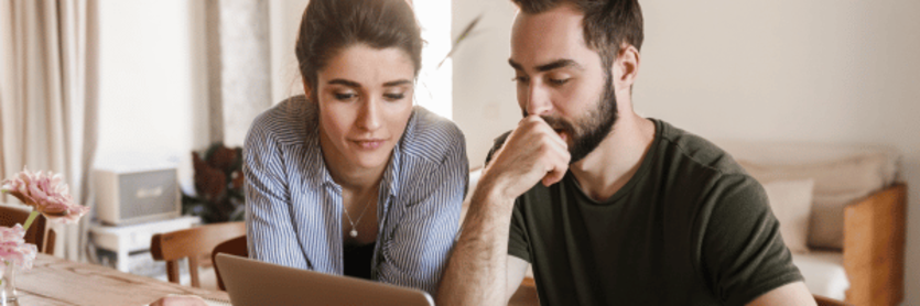 Couple looking at laptop