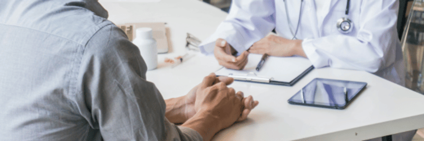 young guy talking with doctor about ED