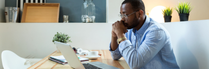 man looking at laptop
