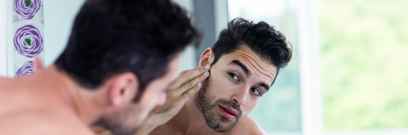 man looking at hair