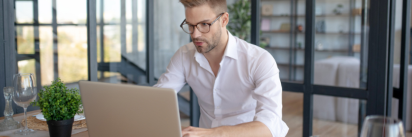 man looking at laptop