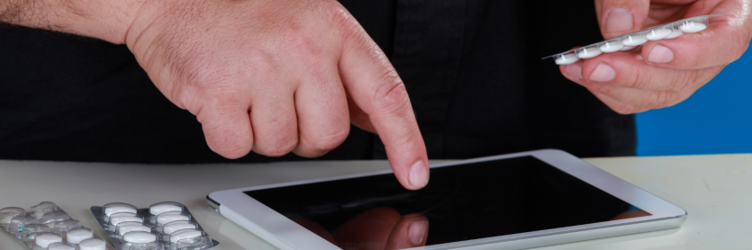 Man ordering tablets on ipad