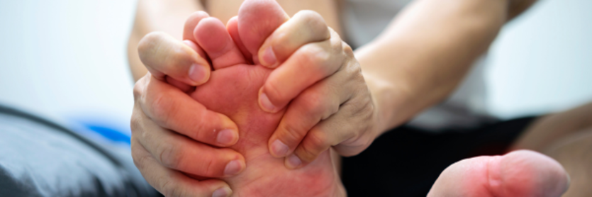 person holding foot