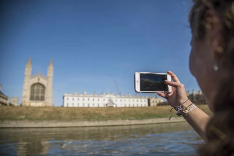 An-Oxford-Summer-Courses-student-taking-a-photo-from-the-River-Cam-the-central-river-in-Cambridge