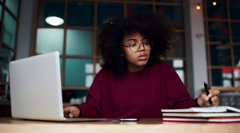 female-student-at-desk-working