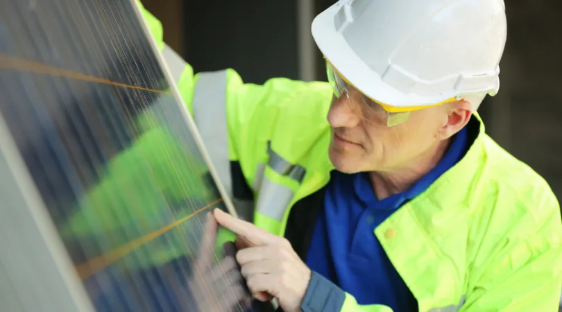 sustainable-engineer-looking-at-solar-panels