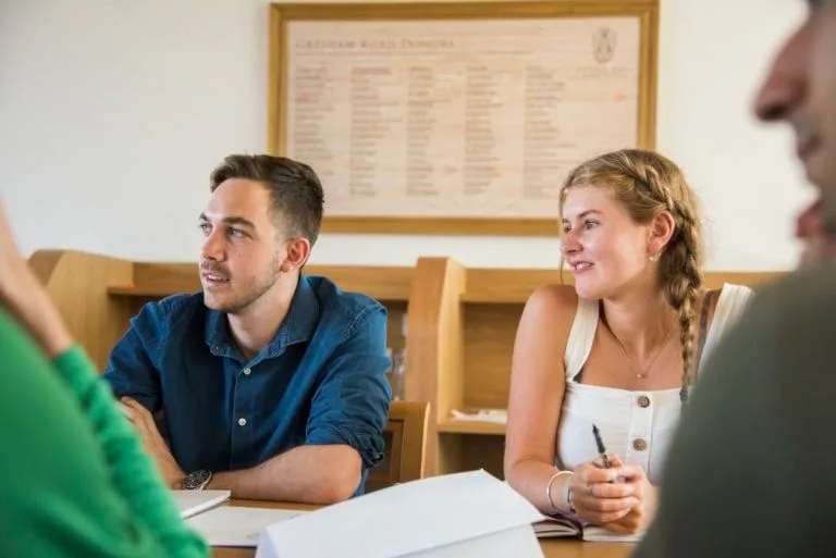 oxford-summer-courses-student-sat-discussing-in-class