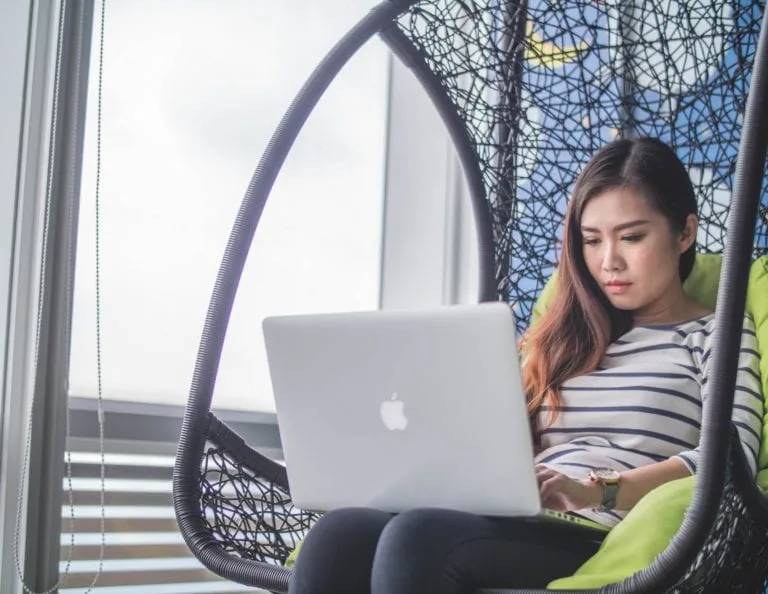 girl-sat-on-laptop-working