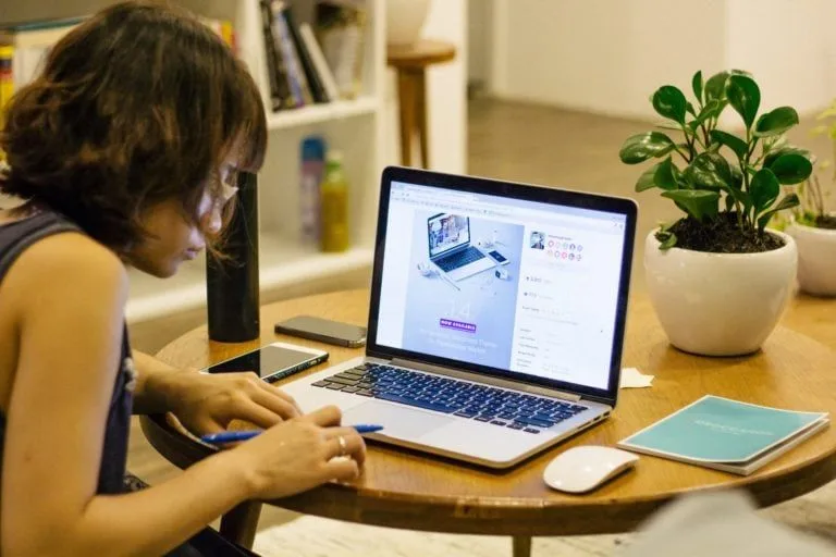 student-working-on-computer-at-desk