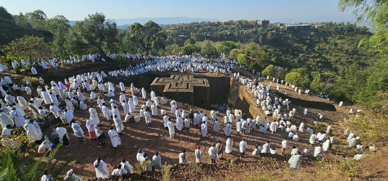 Pilgrims in white around Bete Giyorgis at Genna in Lalibela