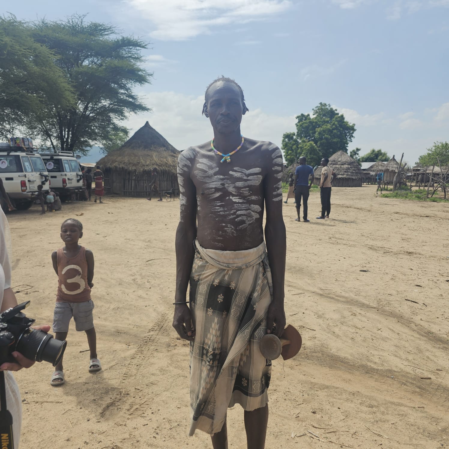 A Karo man with white body paint in his village in the Omo Valley