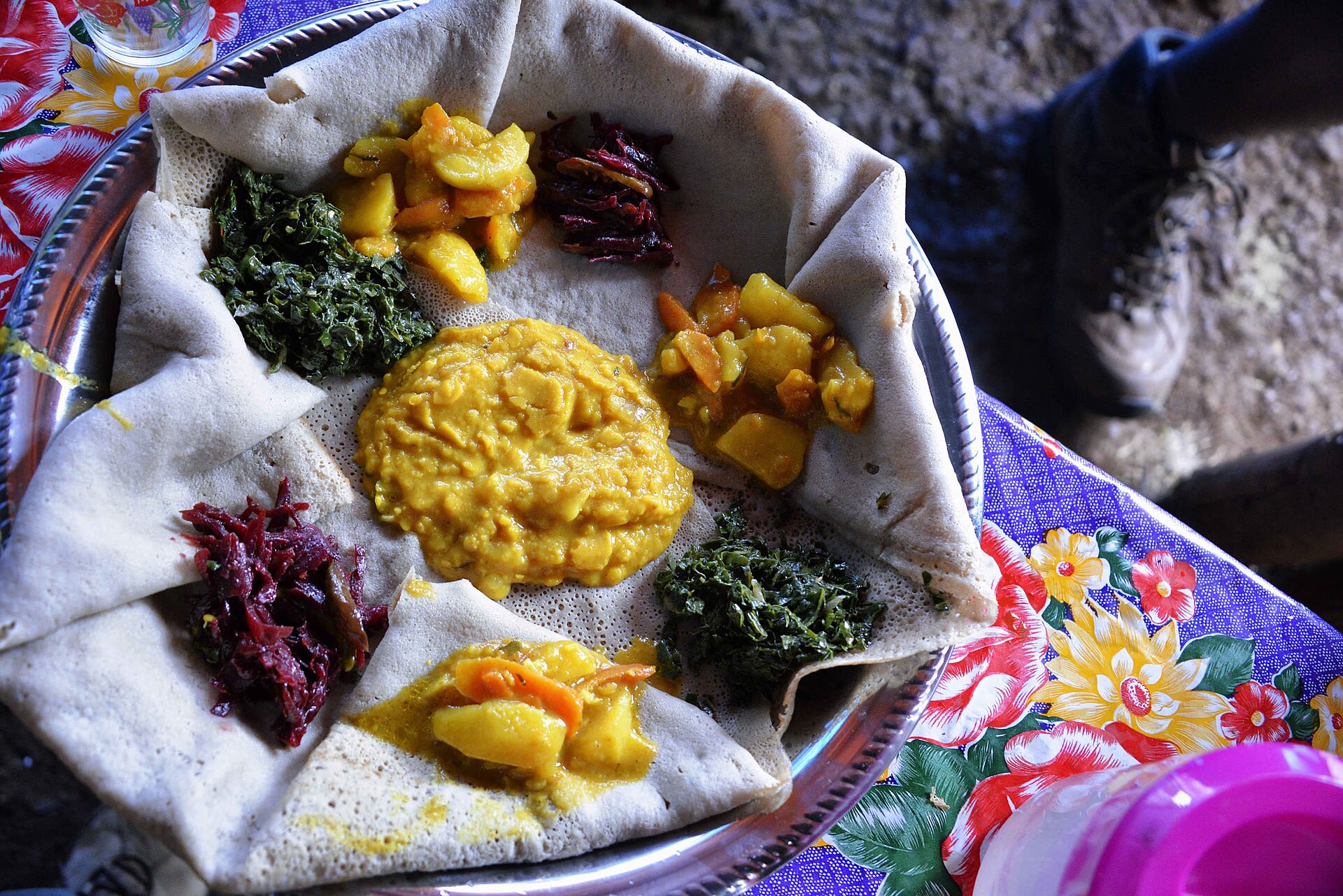 A fasting platter of vegetable stews served on injera