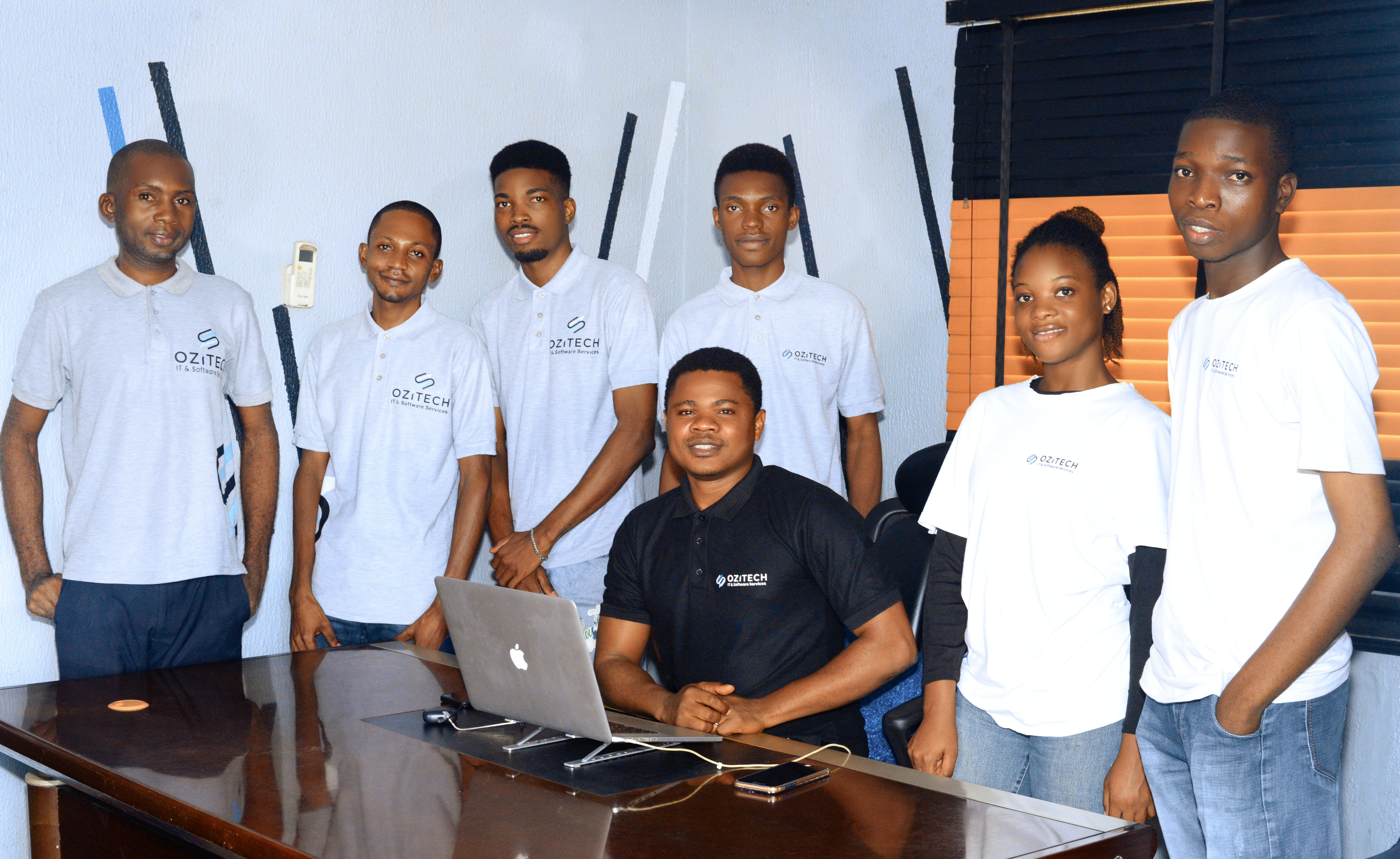 A diverse team of professionals smiling and working together