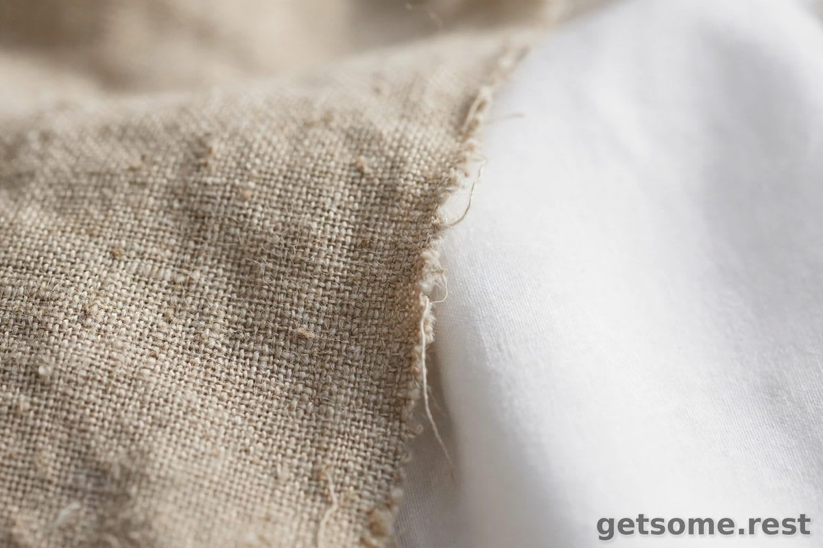 Close-up macro of natural linen fabric weave laid beside smooth cotton fabric