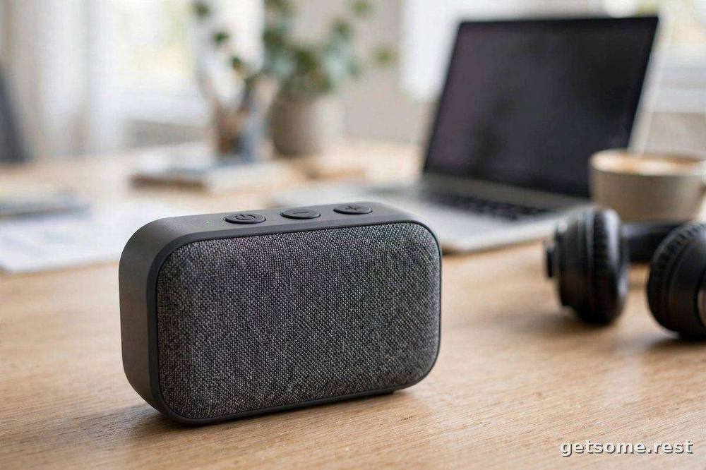 Close-up of a portable white noise speaker on a home office desk