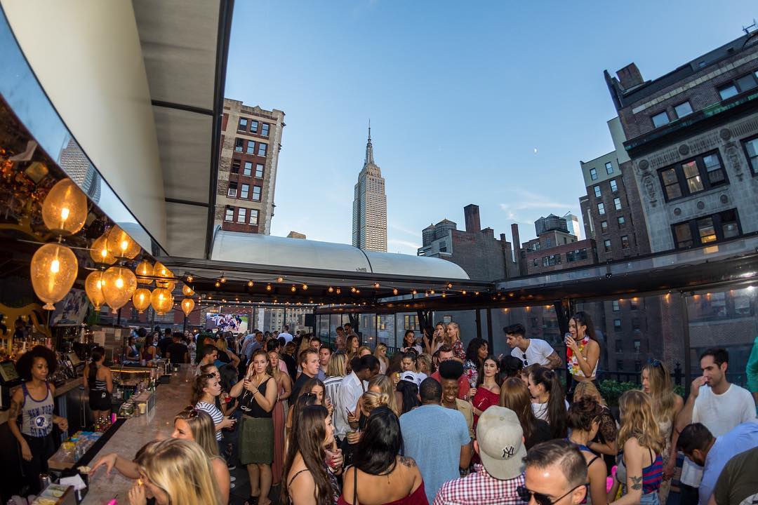 busy-rooftop-bar-with-a-view-of-new-york