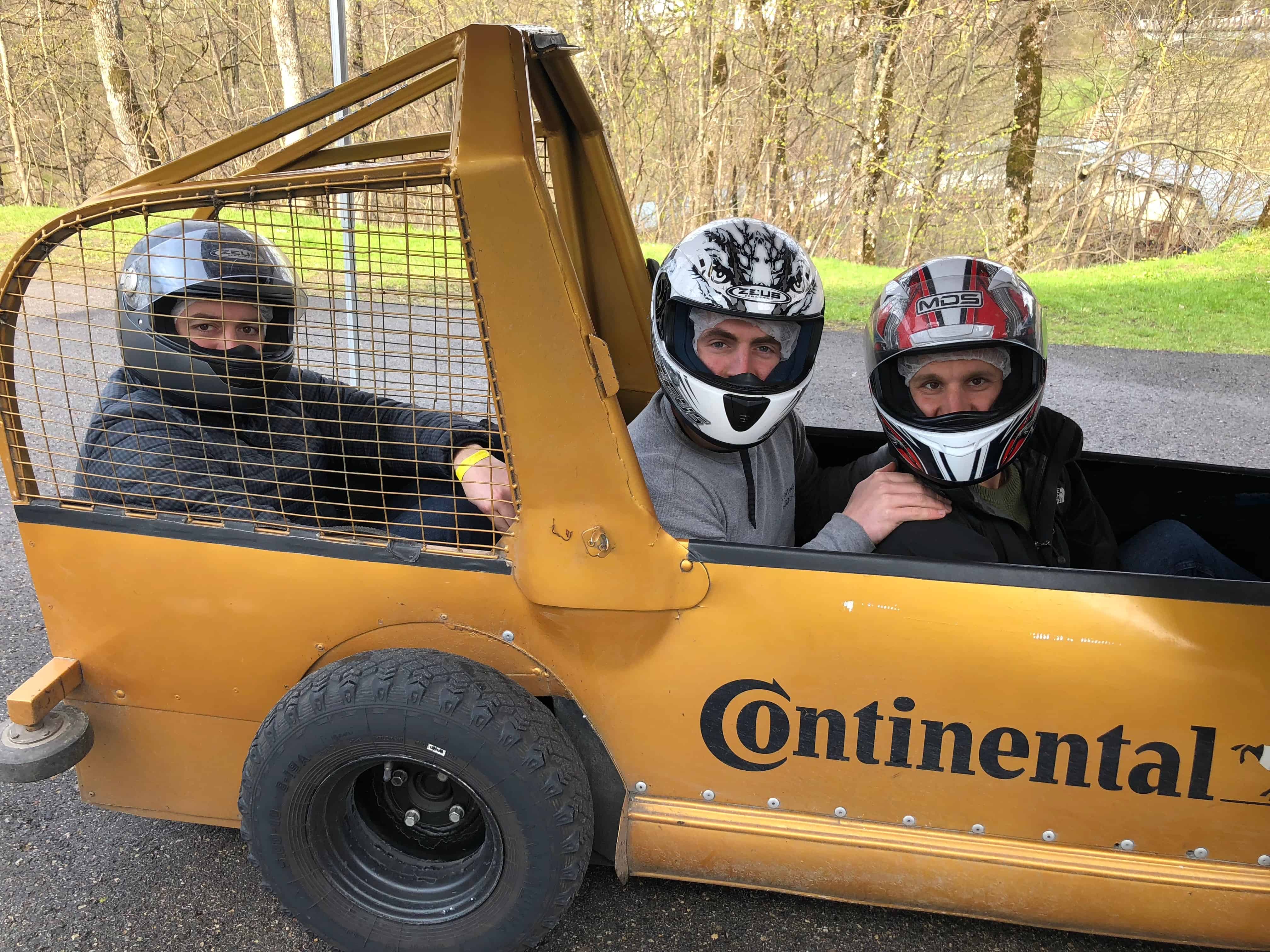 3-men-in-a-bobsleigh-on-wheels