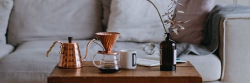 Delicate coffee set arranged on a coffee table