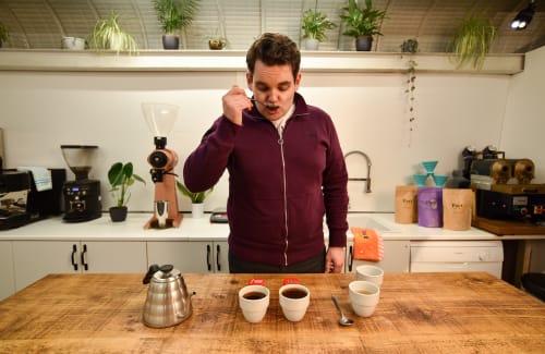 A man tasting coffees