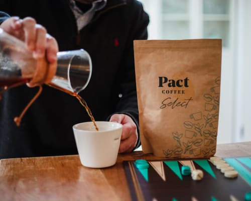 A person pouring coffee