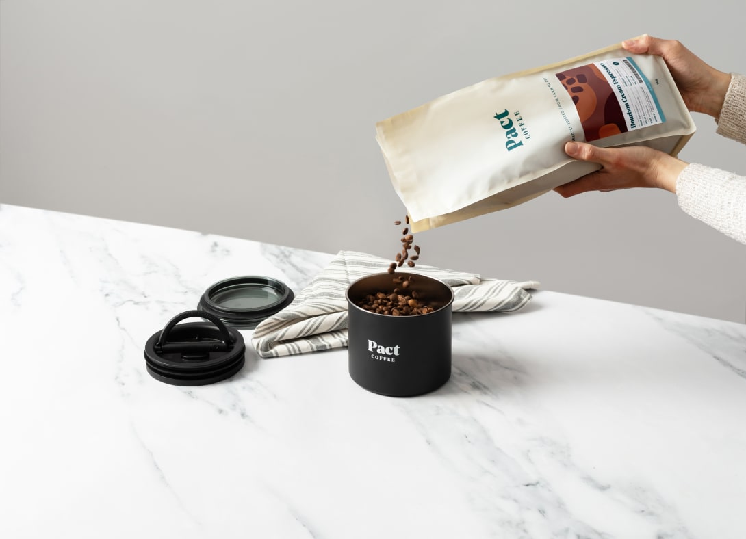 Pouring 1kg coffee beans into the Pact Airtight Canister
