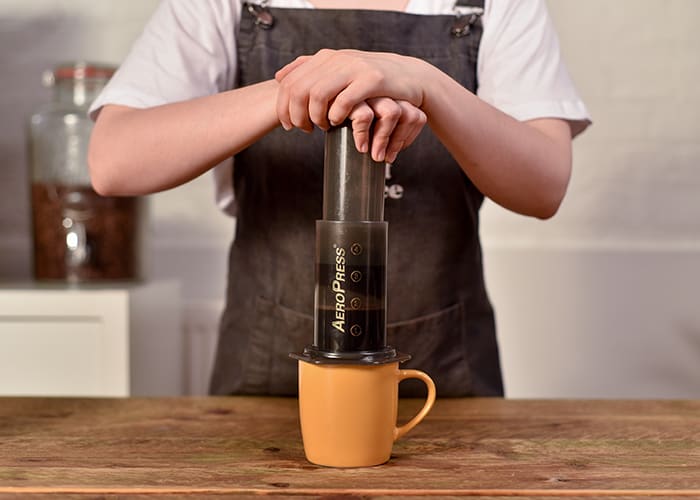 Aeropress in use over a cup