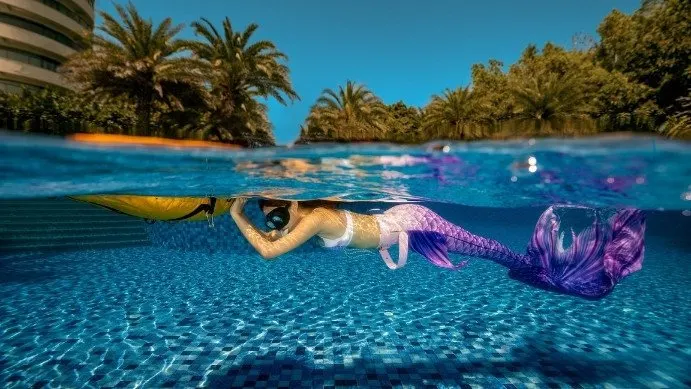 Mermaid practicing in the pool