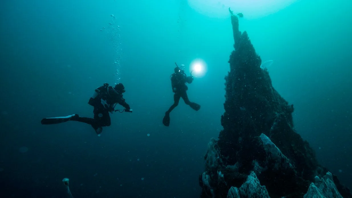 divers exploring a wreck