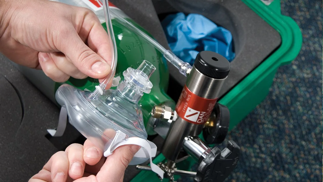 Person inspecting an oxygen mask