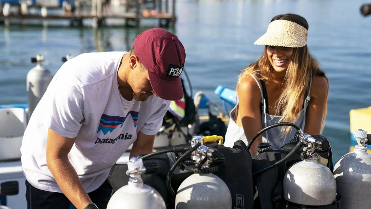 Diver preparing dive equipment