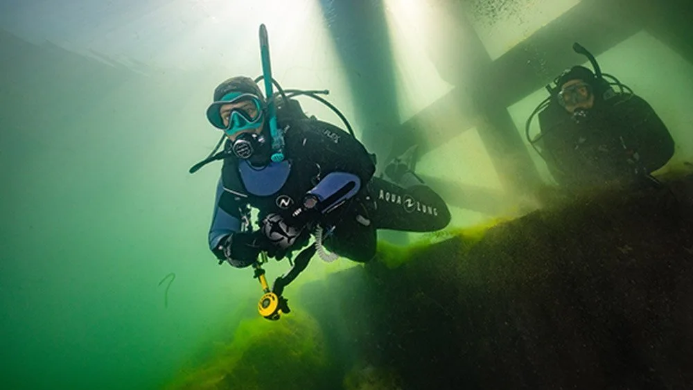 Divers exploring a wreck