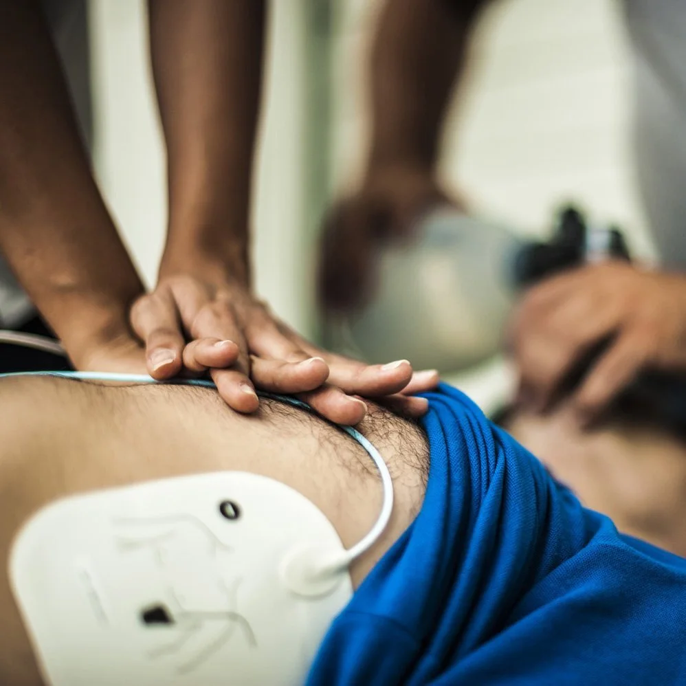 A close up of a person learning CPR.