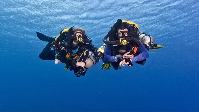 two divers with rebreathers